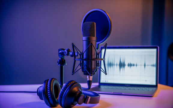 A professional podcast setup photographed in a dark studio with purple and blue ambient lighting