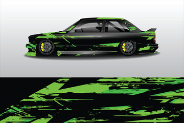 Sleek black car with green abstract design on display