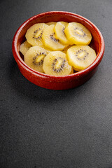 Kiwi yellow slices tasty fruit fresh delicious gourmet food background on table rustic food top view copy space keto and paleo diet vegan and vegetarian food