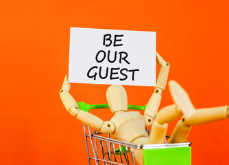 Be our guest symbol. Concept words Be our guest on beautiful white card. Beautiful orange...