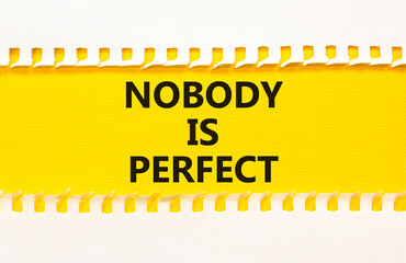 Nobody is perfect symbol. Concept words Nobody is perfect on beautiful yellow paper on clothespin....