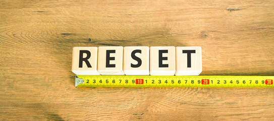 Reset symbol. Concept word Reset on beautiful wooden blocks. Beautiful wooden table wooden...