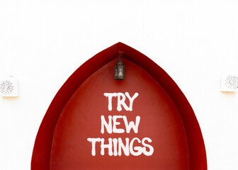 Try new things symbol. Concept words Try new things on beautiful white and red wall. Beautiful white and red wall background. Business motivational lifestyle try new things concept. Copy space.
