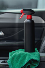 Naklejka premium Car interior with cleaning supplies and microfiber cloth