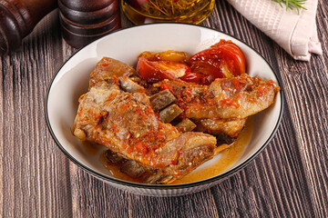 Baked lamb ribs with vegetables