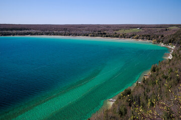 A lookout overlooking Hope Bay with gorgeous turquoise and blue water, beach, and docks jutting out...