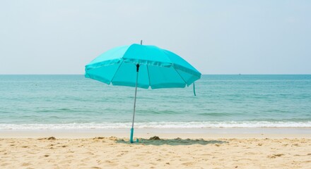 Turquoise Beach Umbrella on Sandy Shore
