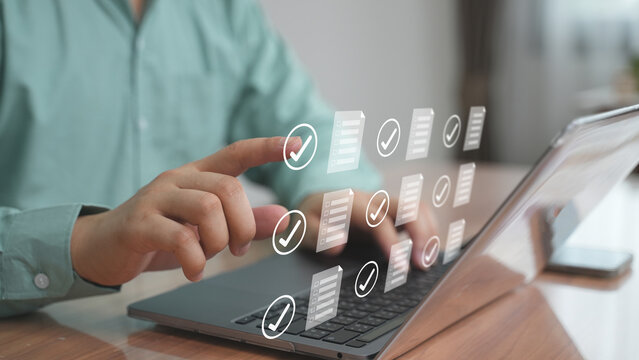 Hands interacting with virtual checklist interface, Concept of task management, to-do list, and productivity planning.