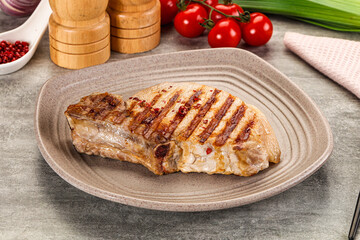 Grilled pork loin steak with bone