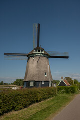 Twiskemolen traditional Dutch windmill in rural farmland near Amsterdam pumps water from the Twiskepolder. Popular tourist attraction in Netherlands  