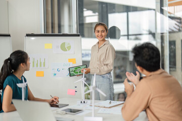 Obraz premium ESG Initiatives in Action. Team working on sustainable business strategies in modern office.