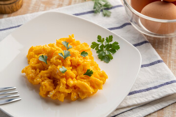 Scrambled eggs in white plate.for healthy breakfast,simple food.