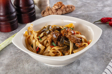 Asian cuisine udon with chicken and vegetables