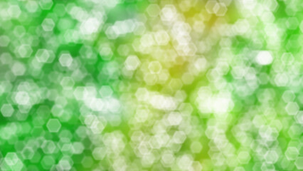 Obraz premium Hexagonal bokeh on green blur background of trees and yellow sunlight. Gradient wallpaper in natural landscape style. Abstract blur pattern.
