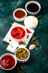 Set of different sauces. Ketchup, mustard, pesto