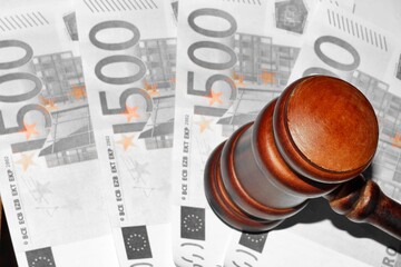 rule of law and auctions with judge's gavel and euro banknotes
