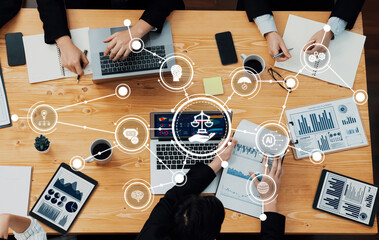 A group of professionals engaged in a business meeting focused on ethics and technology, surrounded by data visualizations and digital icons, fostering collaboration. Amity