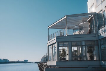 Waterfront property with a balcony captured in sunny morning light, showing modern architecture, detailed textures, and clean surroundings.