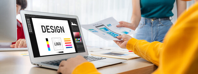 Graphic designer software for modern design of web page and commercial brisk ads showing on the...