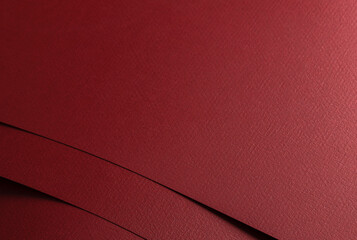 Dark burgundy matte paper texture with a sleek, modern finish, featuring simple geometric lines and