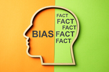 Head outline with words bias and fact.