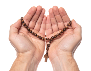 Wooden rosary in hands