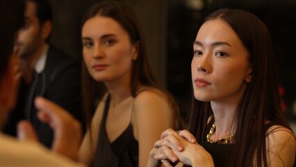Portrait of smiling beautiful woman talking with group friend at luxurious cocktail bar. Capturing natural face beauty with dressing up costume for social interaction upscale at night club. Vinosity.