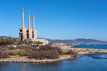 The shutdown thermal power station at Sant Adria near Barcelona with its iconic three smoke stacks