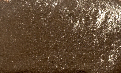 Premium golden foil texture with a sleek, pearlescent finish. Glossy, metallic surface reflecting
