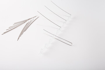 Clear plastic base with metal rods arranged to form bird deterrent segment. Layout demonstrates assembly for specific location. Perfect for pest control brands, urban safety solution providers