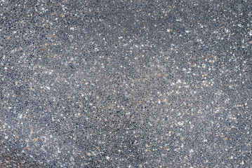Texture of a wall with stone inclusions, background