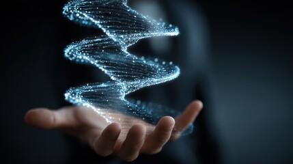 Hand holding a glowing dna helix against a dark background.
