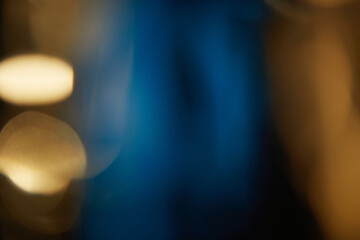 Abstract light leaks on black background with copy space. Studio lens flare bokeh effect.