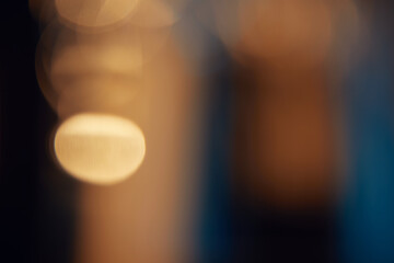 Abstract light leaks on black background with copy space. Studio lens flare bokeh effect.