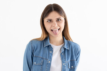 Photo of cheerful funny girl rolled tongue make eyes look at each other isolated white color background