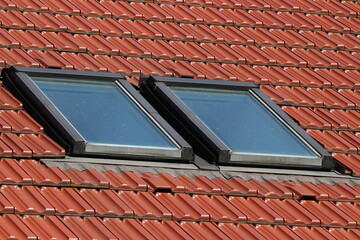 Skylight roof window on a red tilled roof 
