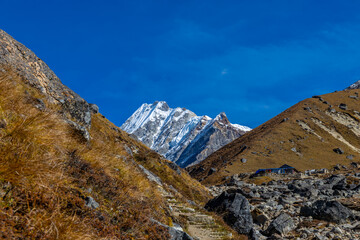 Mera Peak high altitude mountain summit ascent in Himalayas. Stunning views above the clouds at sunrise from the top of the mountain. Alpine route climbing on the snow path in Himalayas