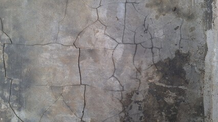 Grunge cement wall texture with weathered surface and distressed stone background, perfect for...