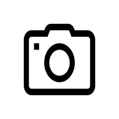 A simple black and white line drawing of a camera with a lens and a flash square on the upper left side