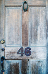 Old weathered wooden door. Close up view