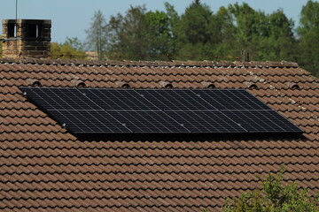 Solar panels on a house textured background 