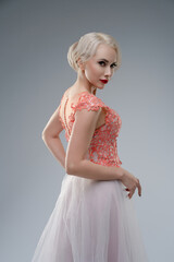 Bride in stunning dress with striking blood effect in studio setting