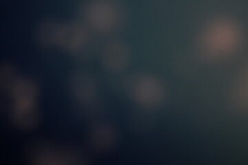 Christmas lights in bokeh. Outside in December. Snow and blue bokeh on a black background, bokeh abstract background, modern technological abstract background. Blue Christmas background, Xmas bokeh 
