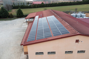 Solar panels installed on the roof of a building generating clean energy