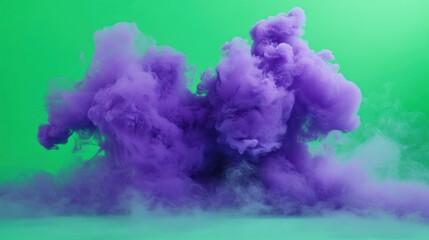 Fototapeta premium Dramatic purple cloud formation against vivid green backdrop for creative concepts