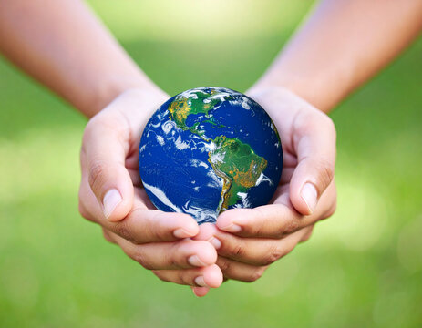 Hands gently holding the Earth represent stewardship and the global responsibility for environmental protection.