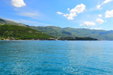 Obraz premium PERAST, MONTENEGRO - May 06, 2024: Village Perast on coast of Boka Kotor bay. Montenegro. Adriatic sea. During spring on a sunny day.