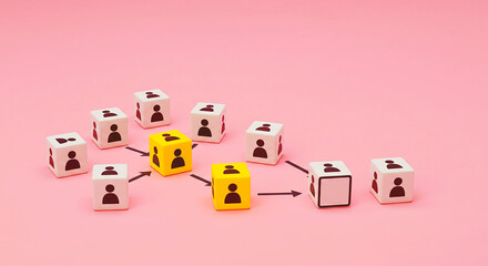 Obraz premium Arrangement of white and yellow cubes with person icons connected by arrows on a pink background