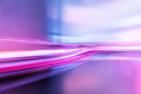 Abstract purple and blue motion blur light trails.