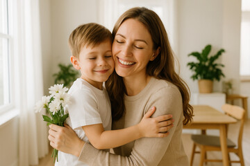Mother hugs son in living room.